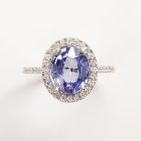 A tanzanite, diamond and eighteen karat white gold ring