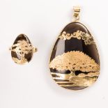 A smoky quartz and fourteen karat gold pendant and ring suite