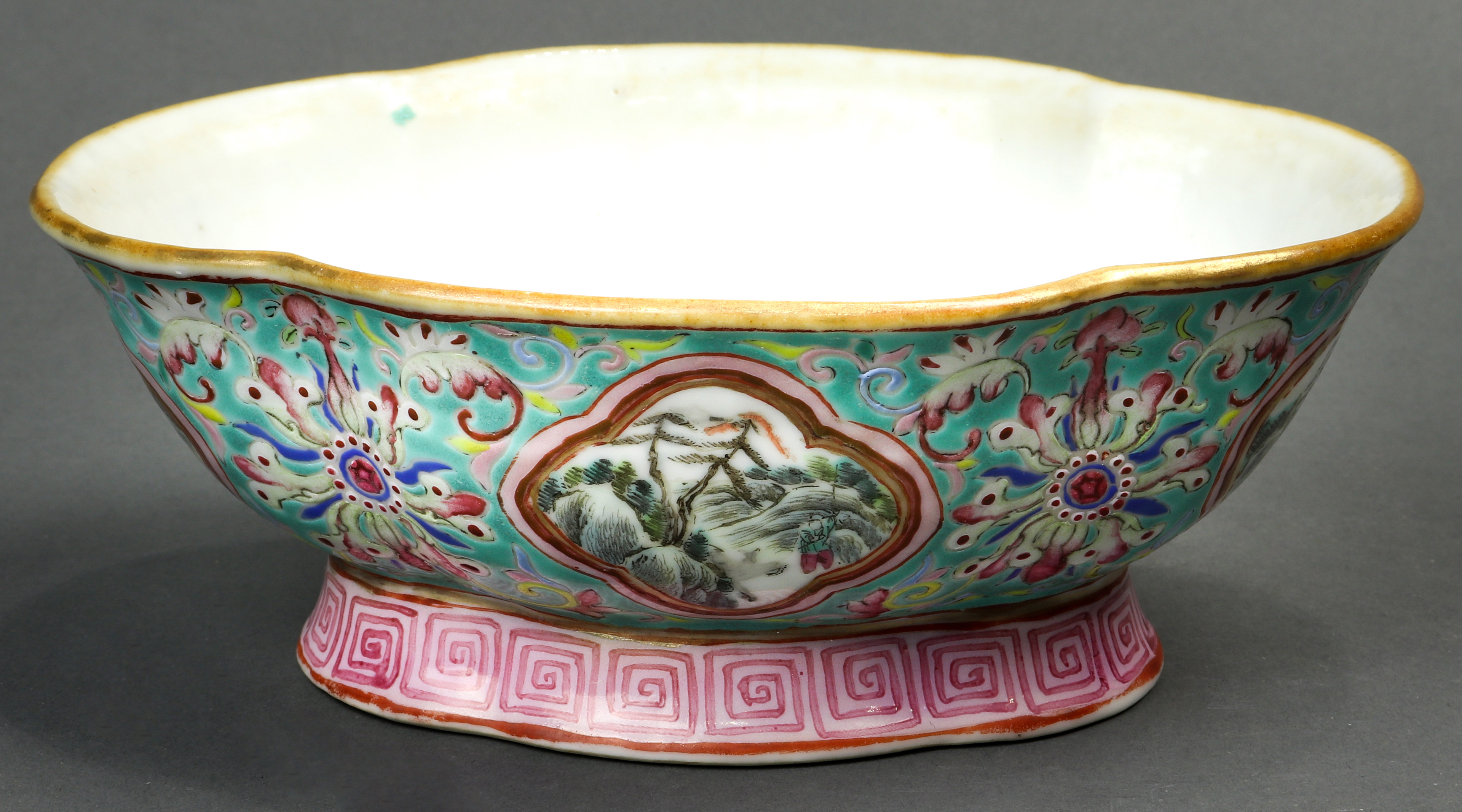 A Chinese Famille Rose turquoise ground pedestal dish