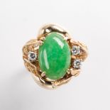 A jade, diamond and fourteen karat gold ring