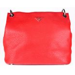 A Prada handbag, executed in red leather with a 7