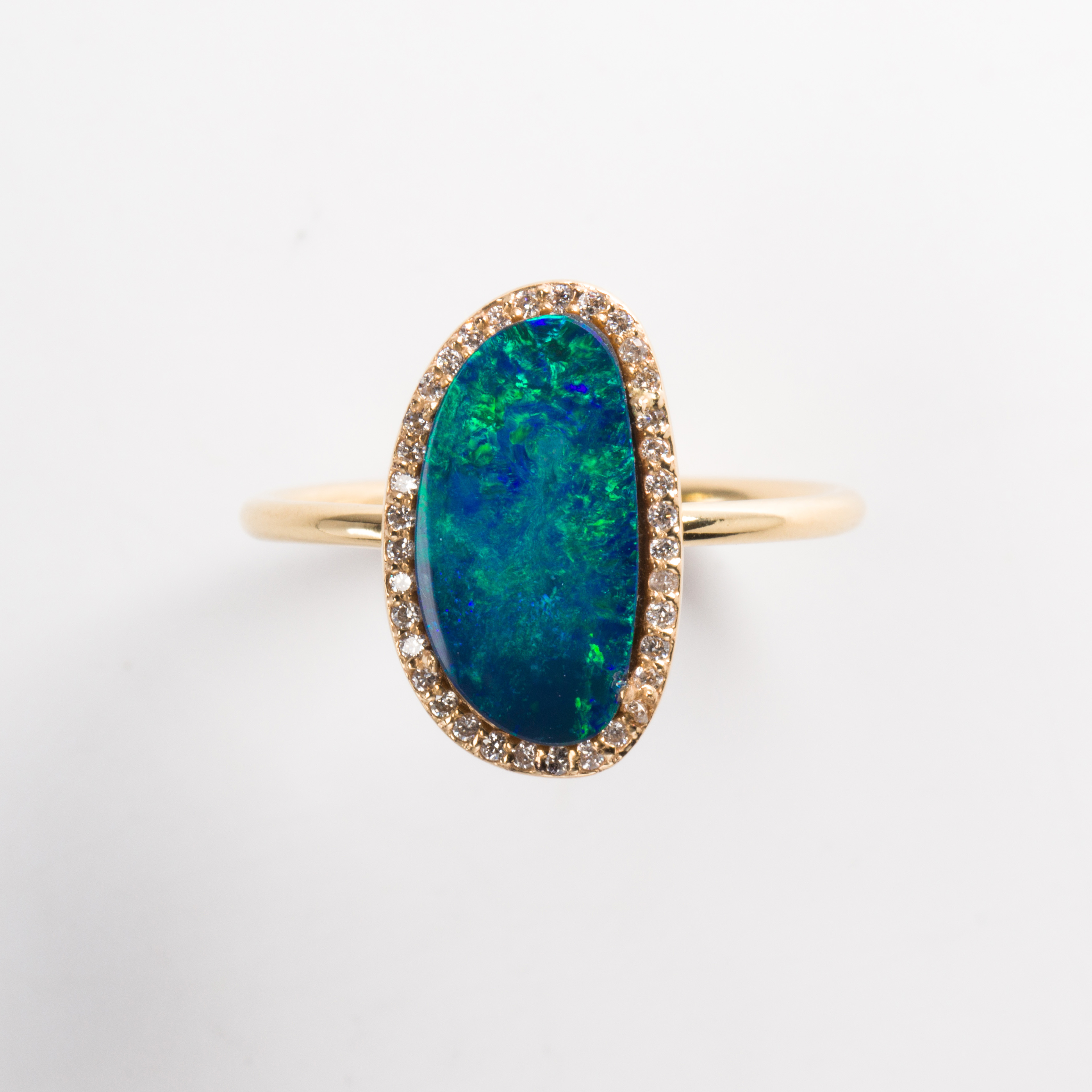 A black opal triplet, diamond and eighteen karat gold ring