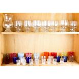 Two shelves of BIOT French bubble glasswares