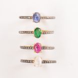 A group of gemstone and diamond stacking rings