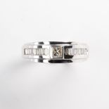 A diamond and fourteen karat white gold ring