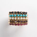 A gemstone and fourteen karat gold ring