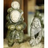 (lot of 2) Group of Inuit soapstone figural sculptures
