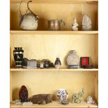 Three shelves of decorative items
