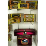 Four shelves of model trains including Rail King MTH Electric trains