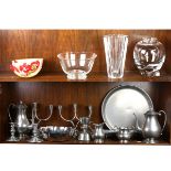 Two shelves of glass and pewter tablewares