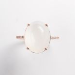 A moonstone and fourteen karat rose gold ring