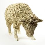 A life-sized figural sculpture of a lamb