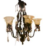 A wrought metal and glass six arm chandelier