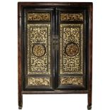 A Chinese lacquered and gilt wood tea cabinet
