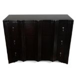 A modern ebonized chest of drawers