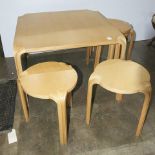 (lot of 6) A Modern coffee table with five conforming stools
