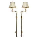 A pair of adjustable brass wall lamps