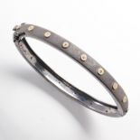 A diamond and blackened silver bangle bracelet
