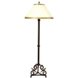 A Spanish Revival style patinated metal floor lamp