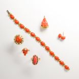 A group of coral and gold jewelry