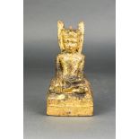 Southeast Asian giltwood figure of seated Buddha on a pyramid form base