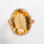 A citrine, diamond and fourteen karat gold ring