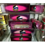 Three shelves of MTH Electric trains