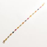 A sapphire, ruby and eighteen karat gold bracelet