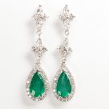 A pair of emerald, diamond and eighteen karat white gold earrings