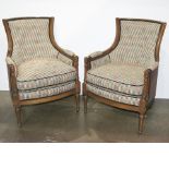 A pair of Regency style upholstered armchairs