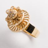 A diamond and fourteen karat gold ring