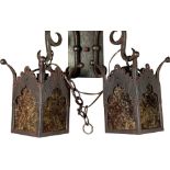 A pair of Spanish Revival style patinated metal wall sconces