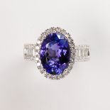 A tanzanite, diamond and fourteen karat white gold ring