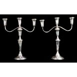 A pair of Gumps sterling weighted three light candelabra