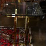 A modern brass and glass table