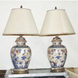 A pair of Italian ceramic paint decorated table lamps