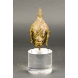 Thai buddha head mounted on a lucite stand