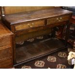 A Georgian oak console table or sideboard