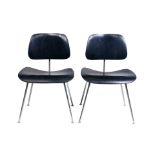 A pair of Charles and Ray Eames DCM chairs