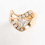 A diamond and fourteen karat gold ring