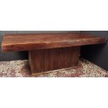 A custom hardwood foyer or dining table, having a solid 4