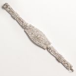 An Art Deco diamond and platinum strap bracelet