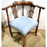 A Chippendale style blue upholstered corner armchair