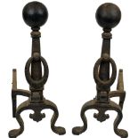 A pair of Spanish Revival andirons, each having a spherical top, above outswept legs, 29.5"h