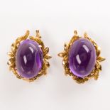 A pair of amethyst and fourteen karat earrings