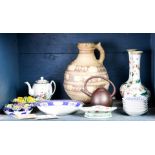 One shelf of Asian style ceramics