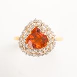 A spessartine garnet, diamond and eighteen karat gold ring