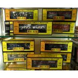 Two shelves of Rail King MTH Electric trains