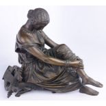 A bronze sculpture of a woman