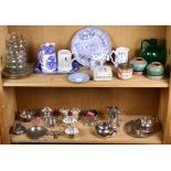 One shelf of ceramic and glass tablewares